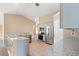 Modern kitchen with granite countertops, stainless steel appliances, and contemporary light fixtures at 708 Alexis Dr., Longs, SC 29568