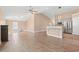 Open-concept living area with hardwood floors, a fireplace, and a view into the modern kitchen at 708 Alexis Dr., Longs, SC 29568