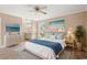 Stylishly staged main bedroom with a blue and white color scheme and an en-suite bathroom view at 708 Alexis Dr., Longs, SC 29568