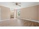 Spacious main bedroom with wood-look flooring, a ceiling fan, and an en-suite bathroom view at 708 Alexis Dr., Longs, SC 29568