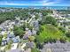 Expansive aerial view of a community near the ocean featuring a mix of homes, trees, and convenient parking areas at 709 Jerdon Circle, North Myrtle Beach, SC 29582