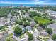 Scenic aerial view of a charming neighborhood with colorful houses, mature trees, and a glimpse of the ocean at 709 Jerdon Circle, North Myrtle Beach, SC 29582