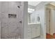 Bathroom features a tiled shower with a built-in niche and a vanity with storage at 709 Jerdon Circle, North Myrtle Beach, SC 29582