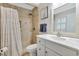 Modern bathroom featuring a tiled shower, marble vanity, and large mirror, creating a luxurious space at 709 Jerdon Circle, North Myrtle Beach, SC 29582