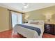 Bright bedroom featuring wood floors, french doors, and stylish nightstands with matching lamps at 709 Jerdon Circle, North Myrtle Beach, SC 29582
