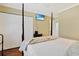 Bedroom featuring a four-poster bed, hardwood floors, and flatscreen TV at 709 Jerdon Circle, North Myrtle Beach, SC 29582