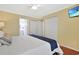 Bedroom with walk-in closets, hardwood floors, ensuite bathroom, and a flat screen TV at 709 Jerdon Circle, North Myrtle Beach, SC 29582
