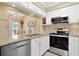 Well-equipped kitchen featuring stainless steel appliances, granite countertops, and custom cabinetry at 709 Jerdon Circle, North Myrtle Beach, SC 29582