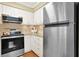 Modern kitchen with stainless steel refrigerator, ample storage, and updated appliances at 709 Jerdon Circle, North Myrtle Beach, SC 29582