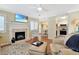 Cozy living room featuring a fireplace, hardwood floors, ceiling fan and comfortable seating at 709 Jerdon Circle, North Myrtle Beach, SC 29582