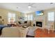 Bright living room with a decorative fireplace, mantle, and plush leather seating, perfect for relaxation at 709 Jerdon Circle, North Myrtle Beach, SC 29582