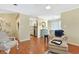 Open living area with hardwood floors, neutral paint, flowing to kitchen and dining, creating inviting space at 709 Jerdon Circle, North Myrtle Beach, SC 29582