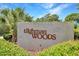 Entrance sign for Tilghman Woods community surrounded by lush greenery at 709 Jerdon Circle, North Myrtle Beach, SC 29582