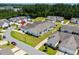 Overview of the neighborhood, showcasing the manicured lawns, pond and tree coverage at 754 Salerno Circle # F, Myrtle Beach, SC 29579