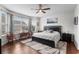 Bright bedroom with ample natural light, dark wood floors, and ceiling fan at 754 Salerno Circle # F, Myrtle Beach, SC 29579
