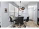 Cozy dining area with glass table and pendant lighting at 754 Salerno Circle # F, Myrtle Beach, SC 29579