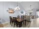 Dining area with chandelier lighting, access to the living room, and decor at 754 Salerno Circle # F, Myrtle Beach, SC 29579