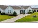 Charming home with well-maintained lawn, neutral siding, dark shutters, and concrete driveway at 754 Salerno Circle # F, Myrtle Beach, SC 29579