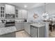 Well-equipped kitchen featuring stainless appliances, stone countertops, and gray cabinets at 754 Salerno Circle # F, Myrtle Beach, SC 29579