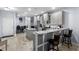 Modern kitchen with a breakfast bar, granite countertops, stainless steel appliances, and light gray cabinets at 754 Salerno Circle # F, Myrtle Beach, SC 29579