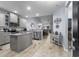 Spacious kitchen featuring stainless appliances, stone countertops, and gray cabinets at 754 Salerno Circle # F, Myrtle Beach, SC 29579