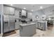 Beautiful kitchen with stone countertops, stainless appliances, island, and tile backsplash at 754 Salerno Circle # F, Myrtle Beach, SC 29579
