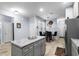 Open-concept kitchen featuring stainless appliances, stone countertops, and island at 754 Salerno Circle # F, Myrtle Beach, SC 29579
