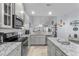 Bright kitchen with granite countertops, stainless steel appliances, and a view of the dining and living area at 754 Salerno Circle # F, Myrtle Beach, SC 29579