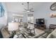 Inviting living room featuring a vaulted ceiling, ceiling fan, and sliding glass doors at 754 Salerno Circle # F, Myrtle Beach, SC 29579