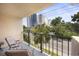 Inviting balcony with seating, offering serene neighborhood views and a relaxing outdoor experience at 7601 N Ocean Blvd. # 3-B, Myrtle Beach, SC 29572