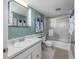 Bathroom featuring a shower with glass doors, vanity and neutral finishes at 7601 N Ocean Blvd. # 3-B, Myrtle Beach, SC 29572