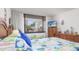 Bright bedroom with two twin beds and a patio view at 7601 N Ocean Blvd. # 3-B, Myrtle Beach, SC 29572