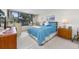 Bright bedroom featuring a large window with outdoor views and light blue comforter at 7601 N Ocean Blvd. # 3-B, Myrtle Beach, SC 29572
