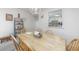 Open dining area showcasing a wooden table with seating, decor, and a pass-through to the kitchen at 7601 N Ocean Blvd. # 3-B, Myrtle Beach, SC 29572