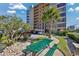 Scenic view of Ocean View Tower grounds with green picnic tables, landscaping, and a view of the building at 7601 N Ocean Blvd. # 3-B, Myrtle Beach, SC 29572