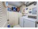 Well-organized laundry area with ample storage cabinets, a washing machine, and a dryer for convenience at 7601 N Ocean Blvd. # 3-B, Myrtle Beach, SC 29572