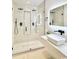 Contemporary bathroom featuring a glass-enclosed shower with dual shower heads and a stylish vanity at 7610 Driftwood Dr., Myrtle Beach, SC 29572