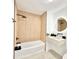 Stylish bathroom featuring a modern vanity and a shower/bath with sleek, linear tiling at 7610 Driftwood Dr., Myrtle Beach, SC 29572