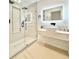 Modern bathroom with a glass-enclosed shower, backlit mirror and sleek vanity at 7610 Driftwood Dr., Myrtle Beach, SC 29572