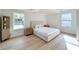 Bright bedroom with hardwood floors, natural light, and neutral decor at 7610 Driftwood Dr., Myrtle Beach, SC 29572
