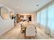 Stylish dining area with hardwood floors, modern lighting, and a view of the kitchen at 7610 Driftwood Dr., Myrtle Beach, SC 29572