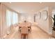 Bright dining room with a large wooden table, contemporary chairs, and modern décor at 7610 Driftwood Dr., Myrtle Beach, SC 29572