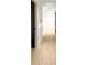 Bright hallway with white walls, hardwood floors, and contemporary trim at 7610 Driftwood Dr., Myrtle Beach, SC 29572