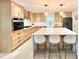 Modern kitchen with a large island, stainless steel appliances, and light wood cabinetry at 7610 Driftwood Dr., Myrtle Beach, SC 29572