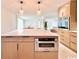 Kitchen island featuring stainless steel oven, quartz countertops, and modern pendant lighting at 7610 Driftwood Dr., Myrtle Beach, SC 29572