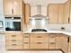Well-equipped kitchen with stainless steel appliances, modern cabinetry, and a bright, clean design at 7610 Driftwood Dr., Myrtle Beach, SC 29572