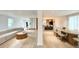 Open-concept living and dining area featuring hardwood floors, modern lighting, and neutral decor at 7610 Driftwood Dr., Myrtle Beach, SC 29572