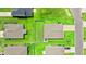 An aerial view shows the rooftops and manicured lawns of homes in a well-maintained suburban neighborhood at 821 Twickenham Loop, Longs, SC 29568