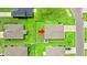 An aerial view shows the rooftops and manicured lawns of homes in a well-maintained suburban neighborhood at 821 Twickenham Loop, Longs, SC 29568