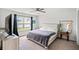 Bright bedroom with a large window, ceiling fan, and carpet flooring at 821 Twickenham Loop, Longs, SC 29568